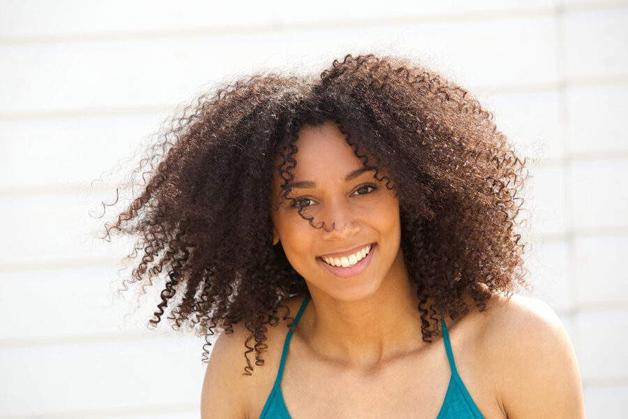 Smiling woman posing outdoors